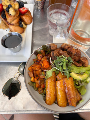 Delicious morning vegan plant-based breakfast in Barbados at Orange Street Grocer, french toast, fruit, plantain, avocado, greens, sweet potato