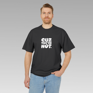 Man wearing a black t-shirt with white 'CUZ YOU'RE NOT.' text on a gray background