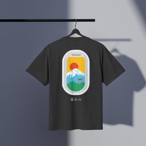 Black t-shirt with a colorful graphic of Mount Fuji on a hanger against a gray background