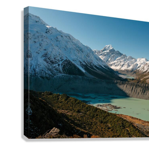 Canvas print of a mountain landscape with snow-capped peaks and a lake. Features Mount Cook / Aoraki and nearby lakes in New Zealand.