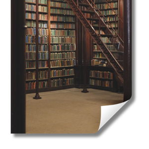 Library with bookshelves and a staircase